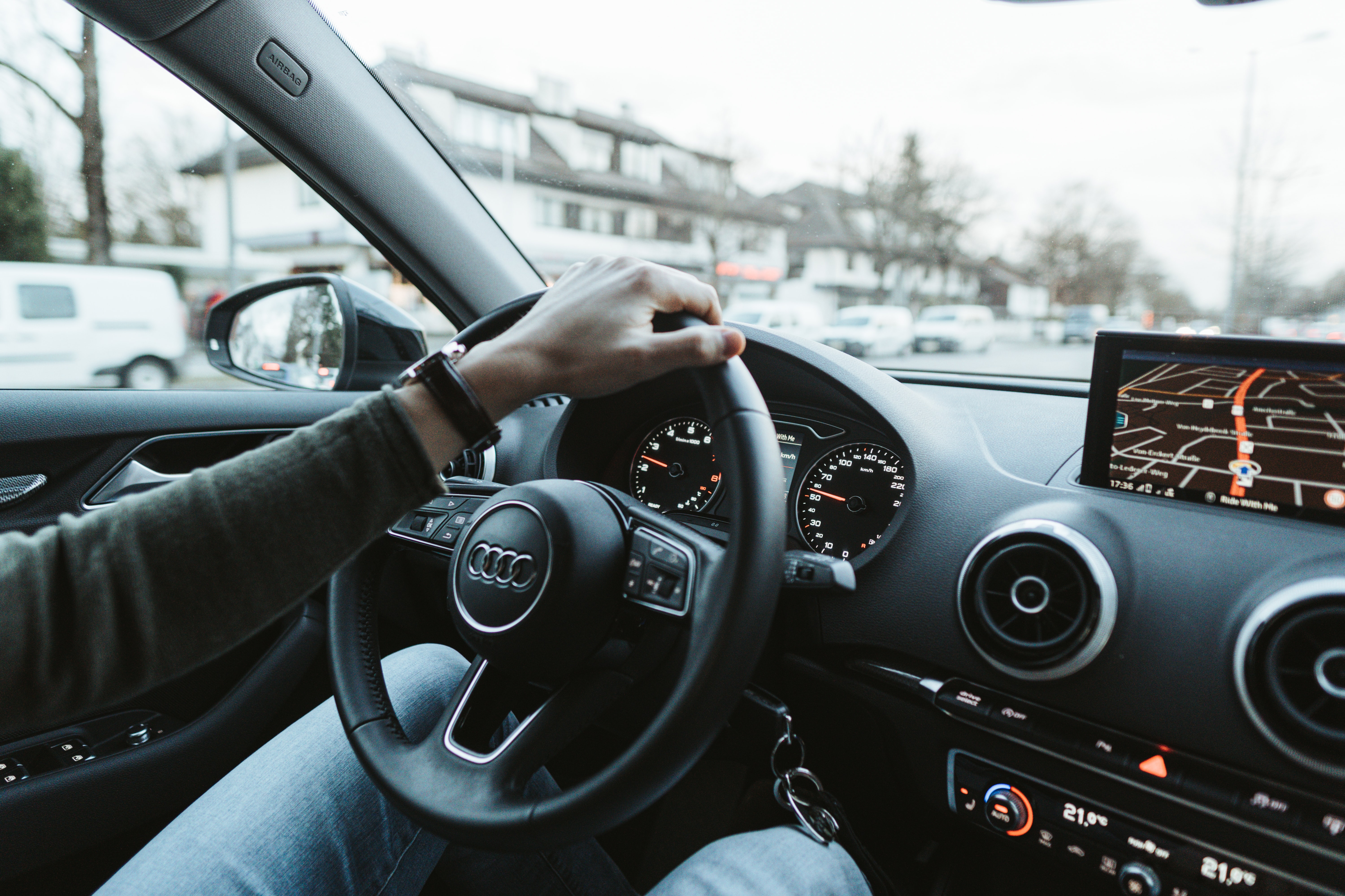 Man driving Audi car